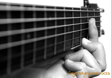 Press down the strings with your fingertips
